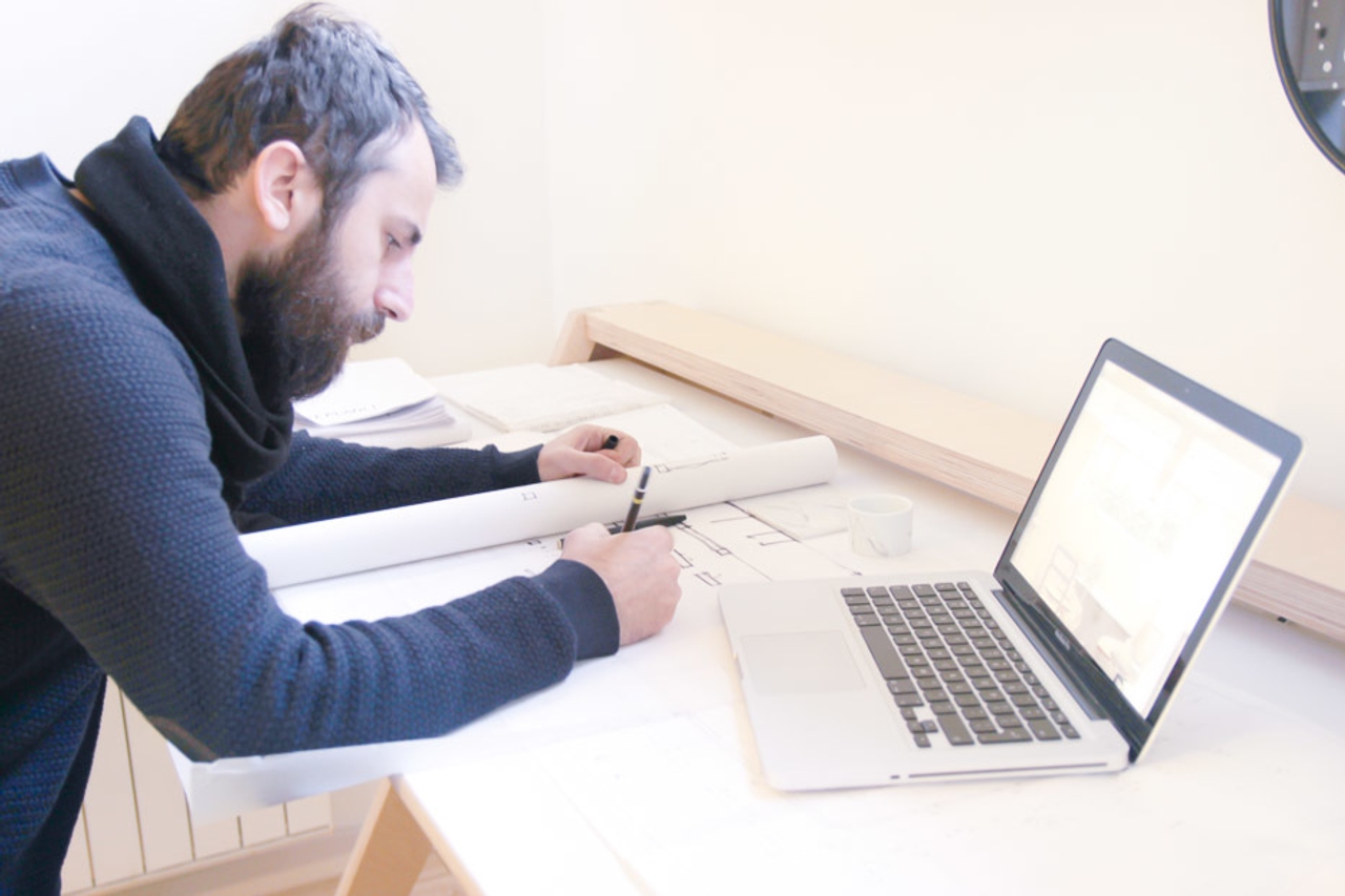 Mill Architects brainstorming ideas on a Lift Standing Desk