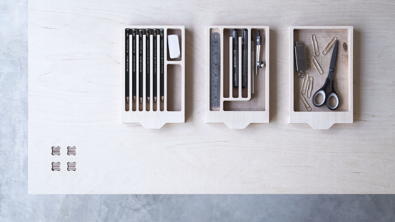 Top view and detail of the trays of the Layout table, a creative user workspace table by Josh Worley for Opendesk